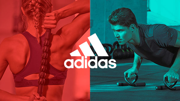 Man using adidas push up bars, woman using adidas massage roller for post-workout recovery