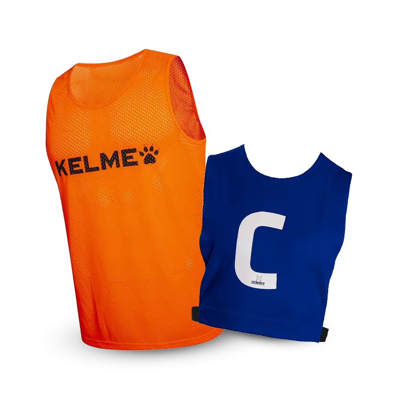 Sports Bib in style of netball bib with strap. SUMMIT brand red sports bib with a number on the top left shoulder worn by female athlete.