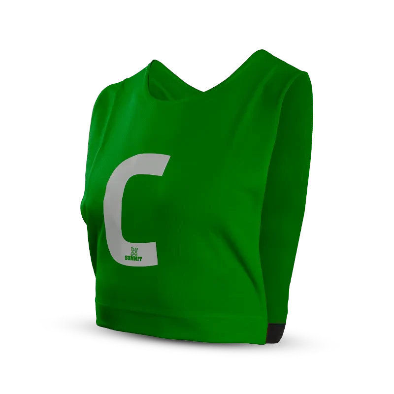 Green netball bib with white Center logo. SUMMIT Green Netball Bib with C printed on front