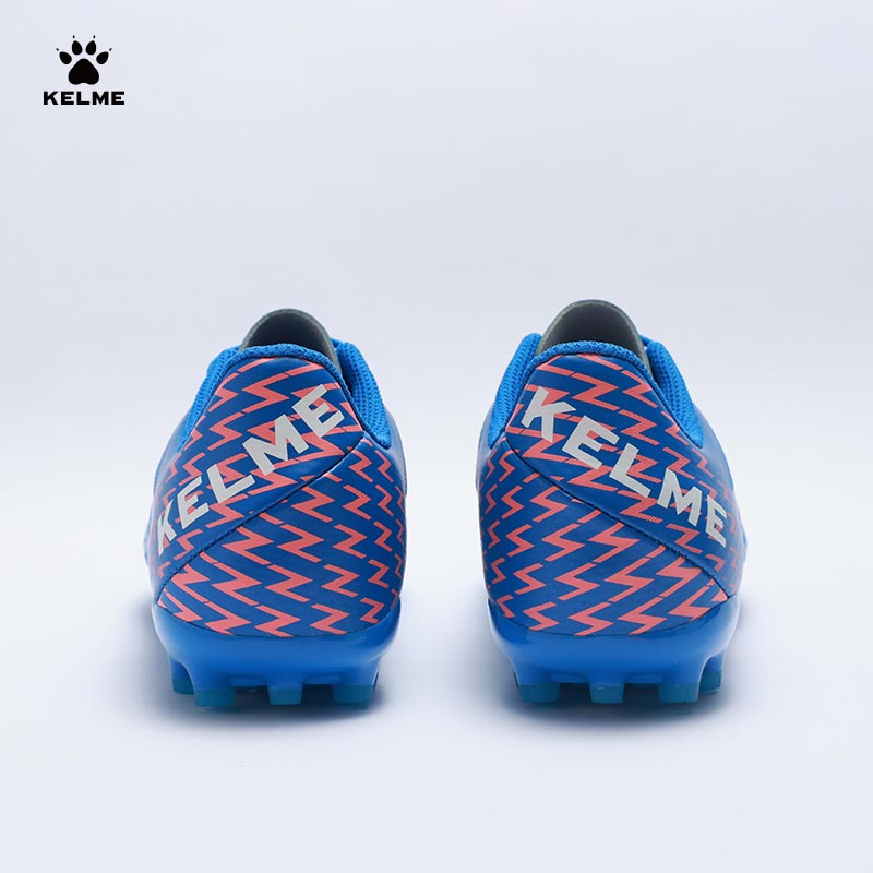 Back view of KELME Bolt Football Boots in blue with orange pattern on heel