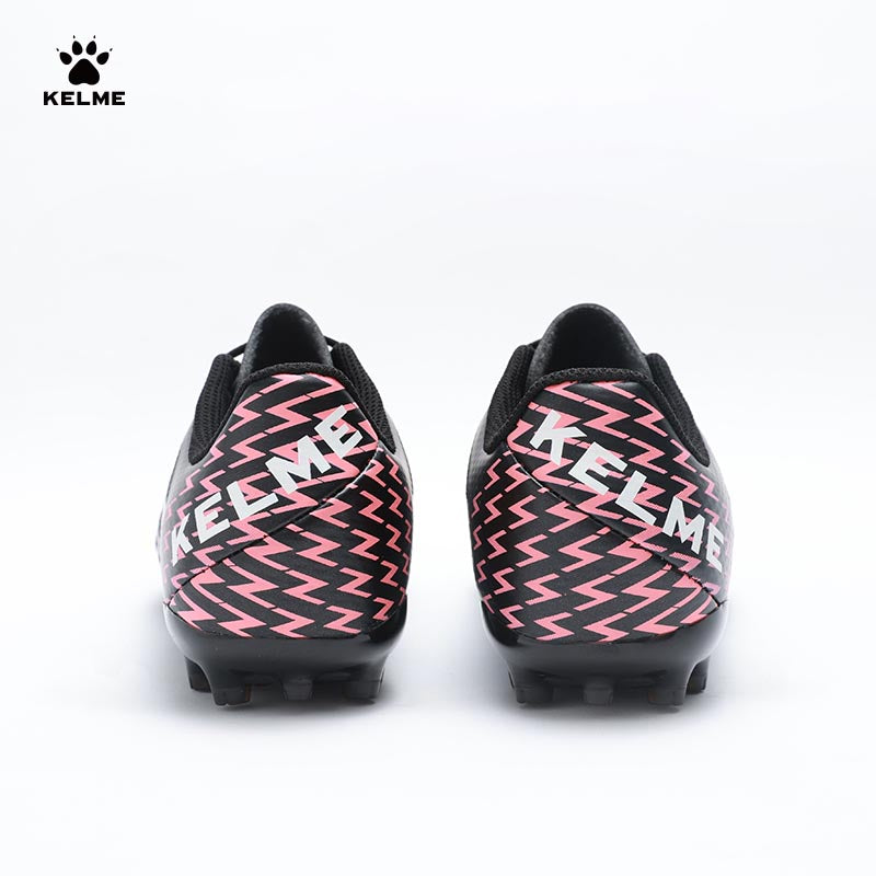 Back view of KELME Bolt Football Boots in black with red pattern on heel