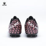 Back view of KELME Bolt Football Boots in black with red pattern on heel