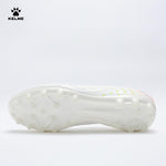 Single white KELME Bolt Football Boot, view from underneath showing the sole