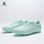 Pair of KELME Bolt Football Boots in mint green