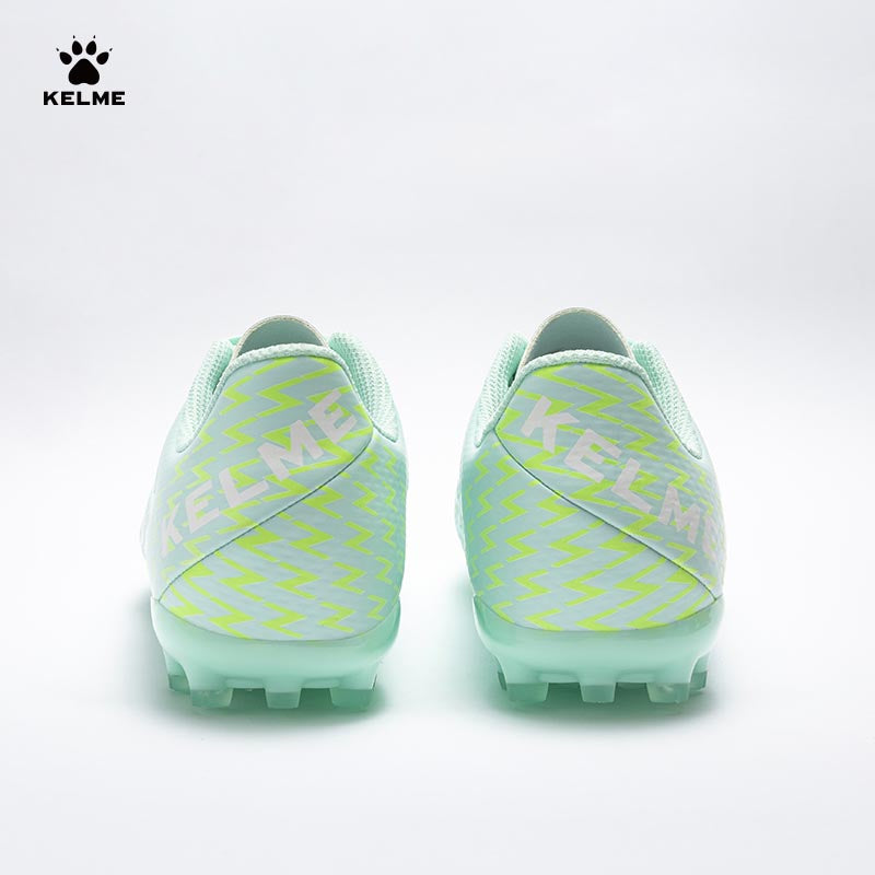 Back view of KELME Bolt Football Boots in mint with neon green pattern on heel