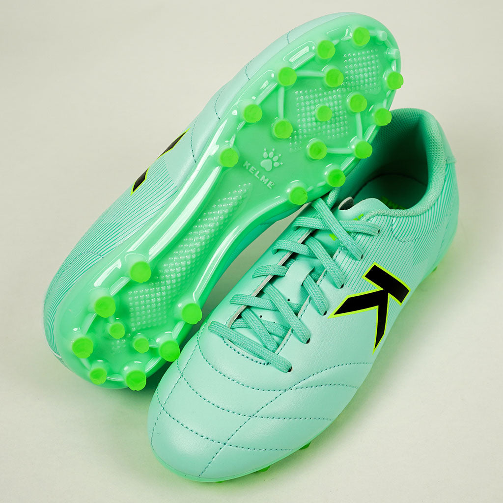 KELME Neo Sr Turf Boots for artificial surfaces - in pale green. Side view of a pair, one sitting on the other.