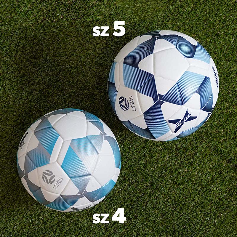 Pair of summit advance x footballs, one white, navy and blue size 5 and one white, silver and blue size 4, pictured on turf. Size comparison for reference.