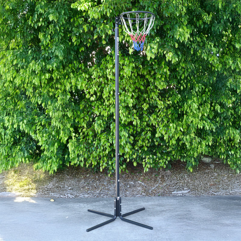 Netball stand against a leafy green background