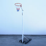 Netball ring system against a white wall.