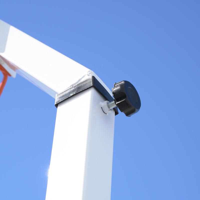 Close up of netball stand tightening screw against a blue sky background