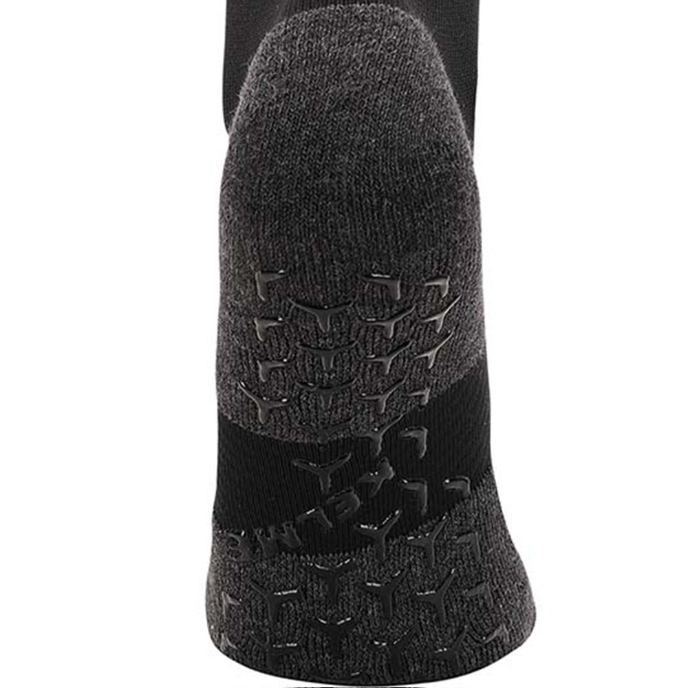 Black full length grip socks showing grip on base of sock to stop slipping in soccer boot.