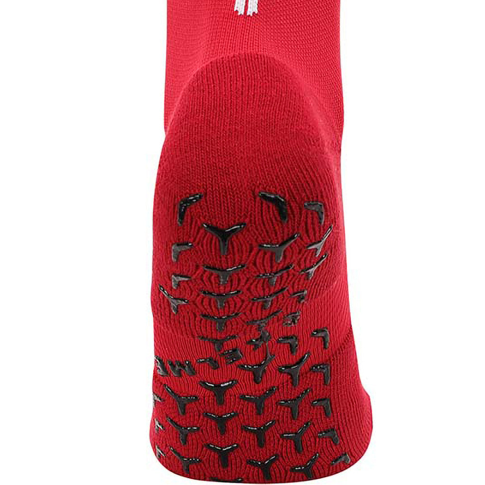 Red full length grip socks showing grip on base of sock to stop slipping in soccer boot.