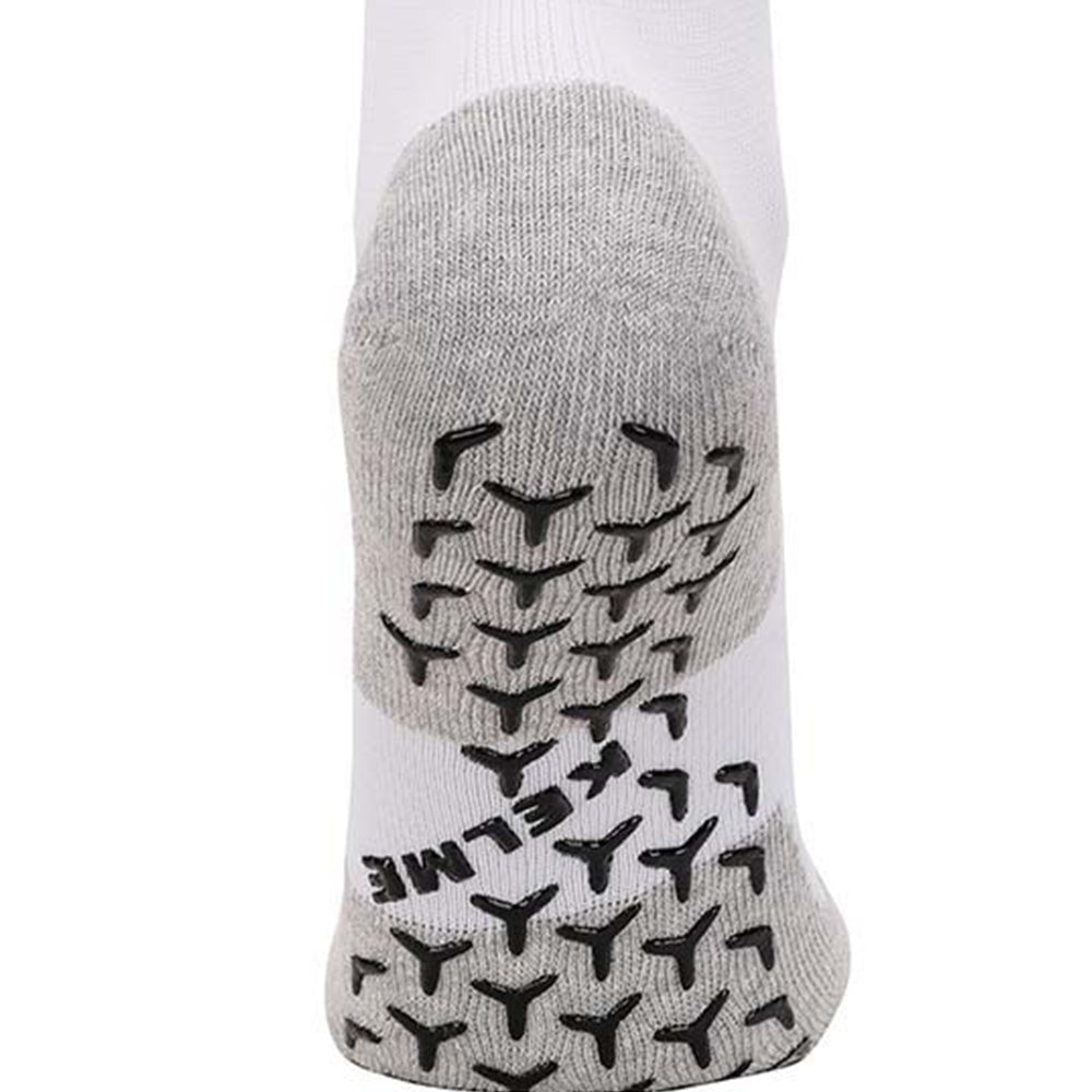 White full length grip socks showing grip on base of sock to stop slipping in soccer boot.