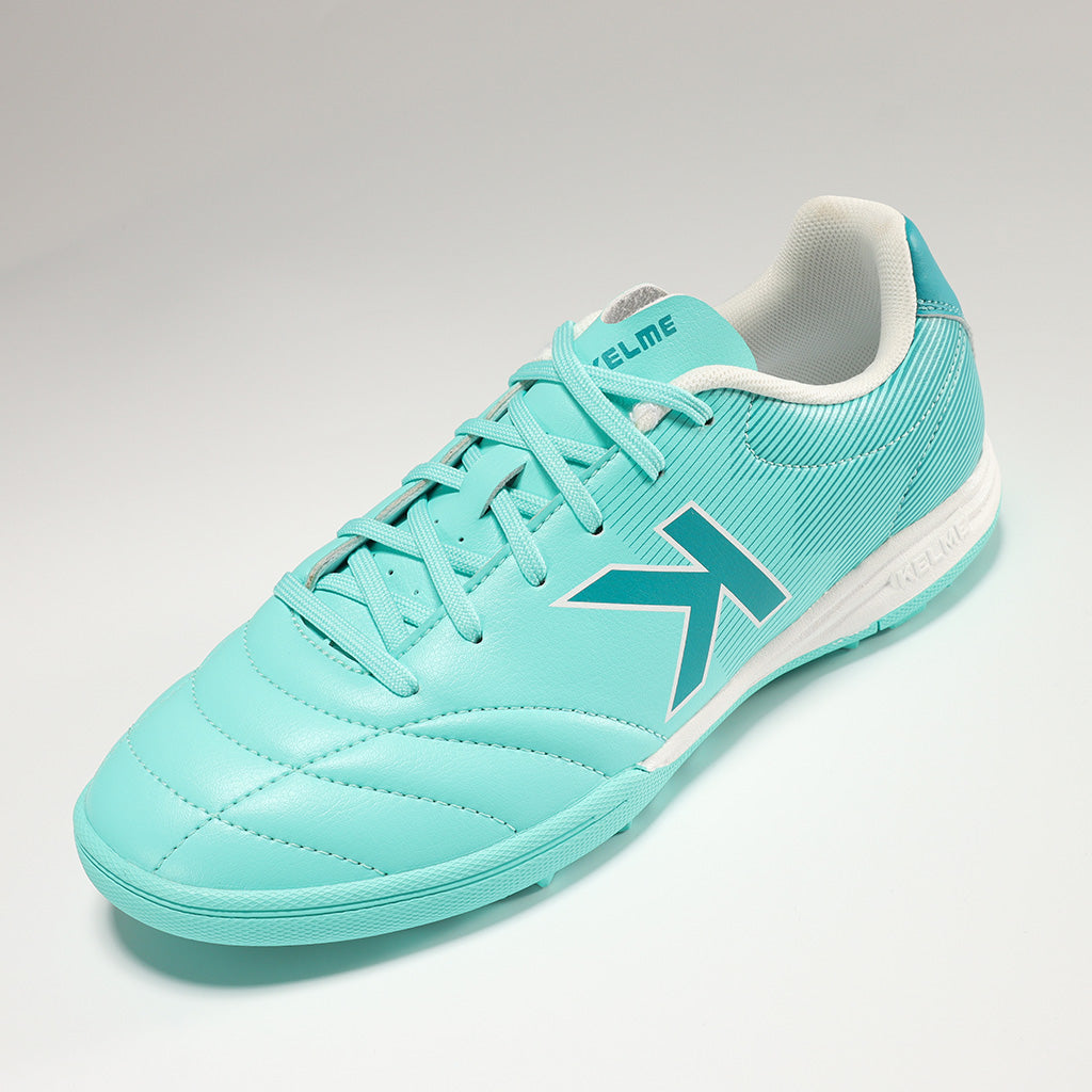 KELME Neo Sr Turf Boots for artificial surfaces - in mint colour, single shoe on an angle