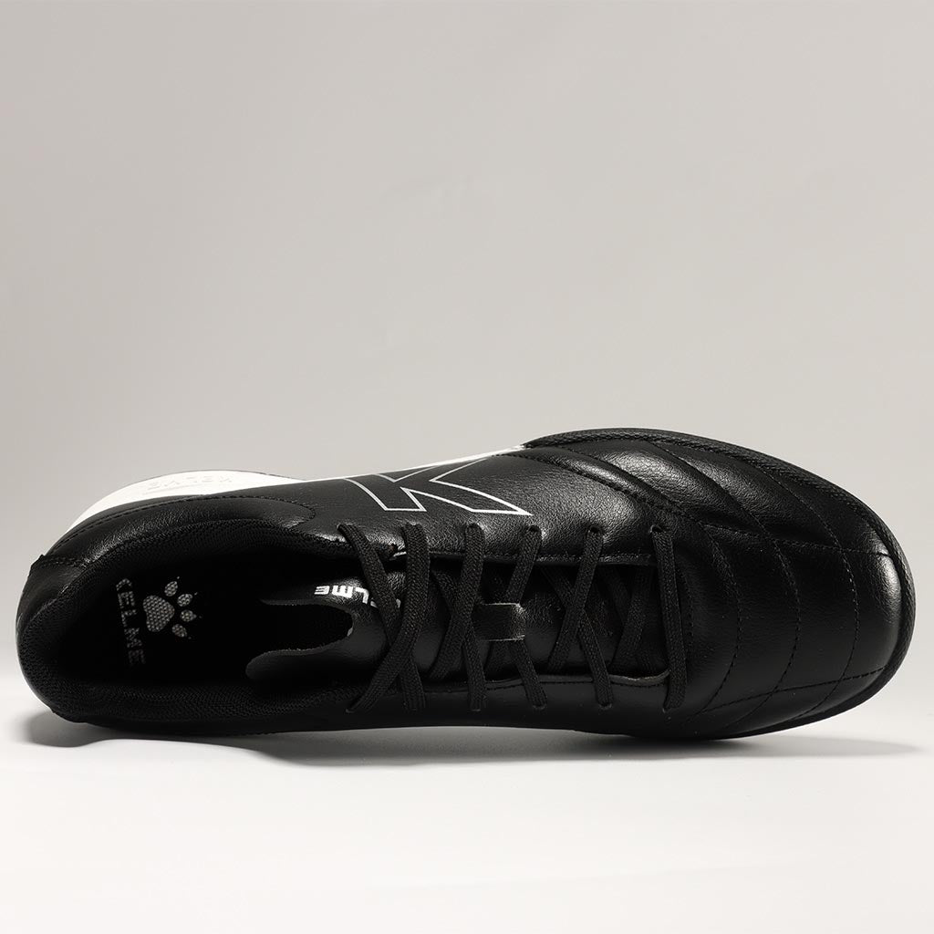 KELME Neo Sr Turf Boots for artificial surfaces - in black and white colour. shot from above showing the inside of shoe.