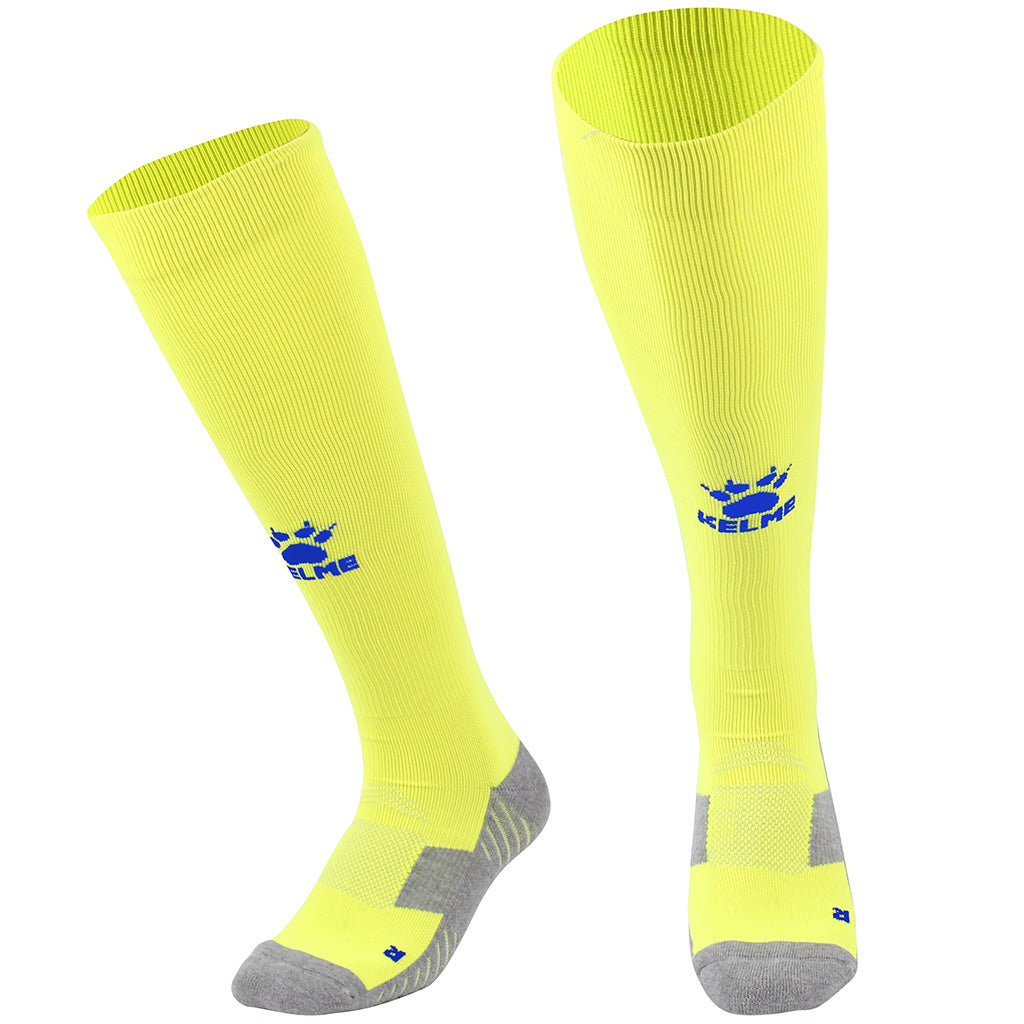 Kelme Football Socks Full Length - yellow colour with royal blue logo. Available at summit sport.