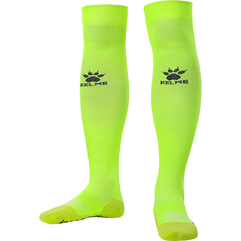 Kelme Football Grip Socks Yellow long front facing. Football knee high grip socks for professional soccer players