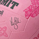 Close-up of a pink netball with Liz Ellis signature and branding