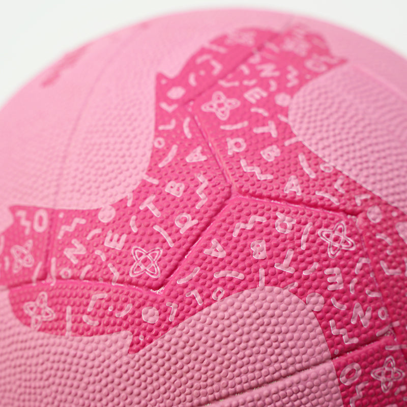 Close-up of a pink netball with branding on a white background
