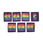 Netball dress team patches in a line with purple and rainbow printed positions