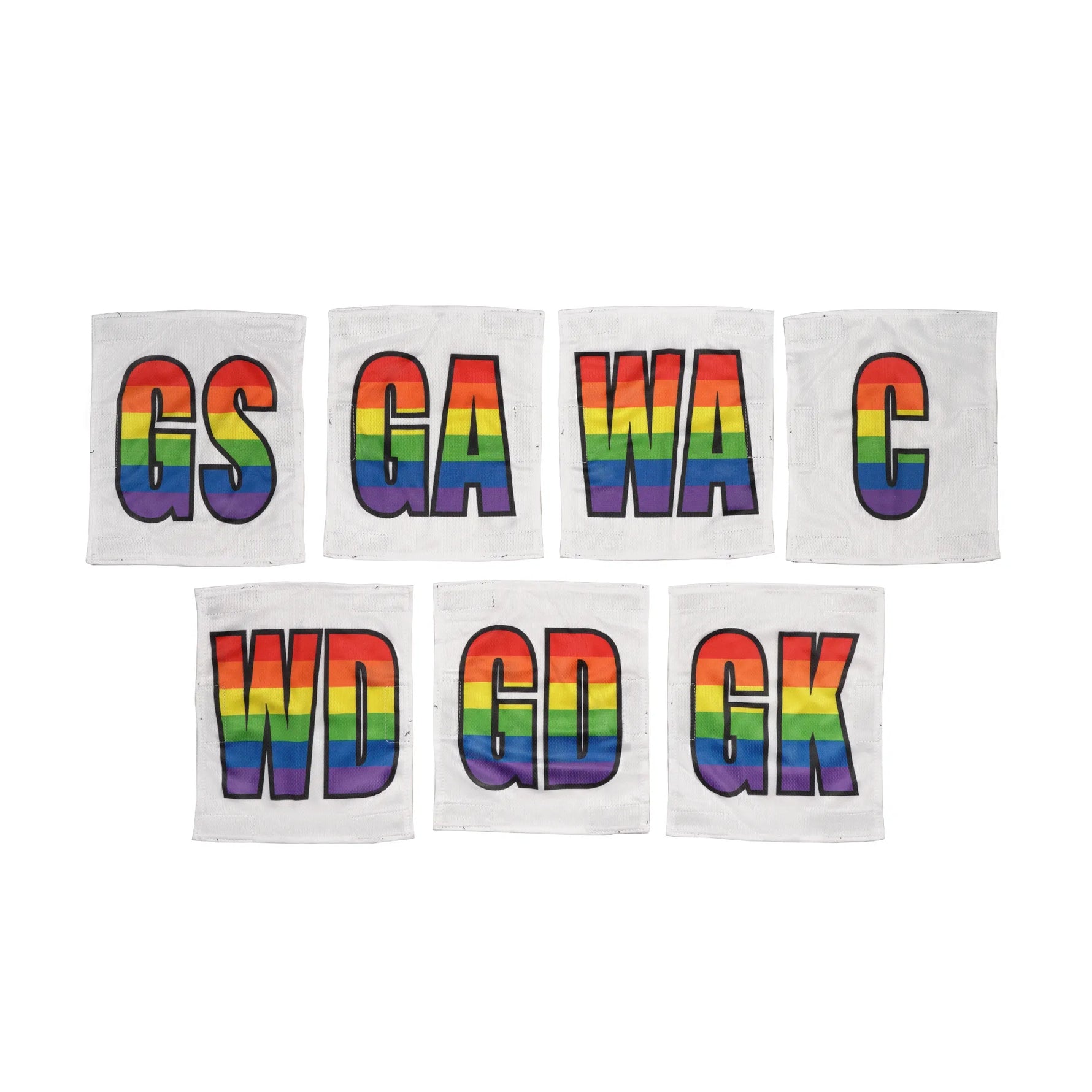 Netball dress team patches in a line with white and rainbow printed positions