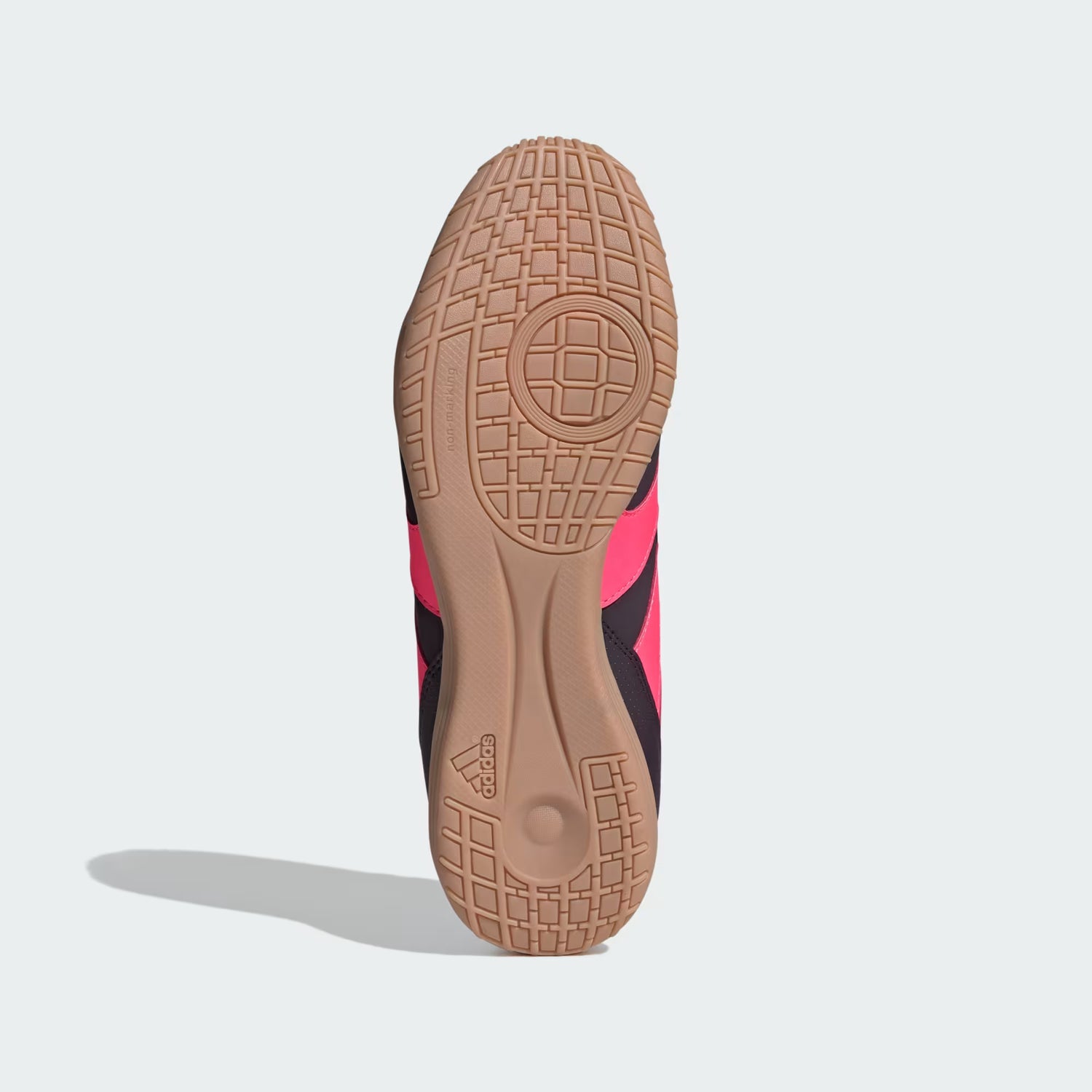 Close-up of a shoe sole with a textured pattern on a light gray background