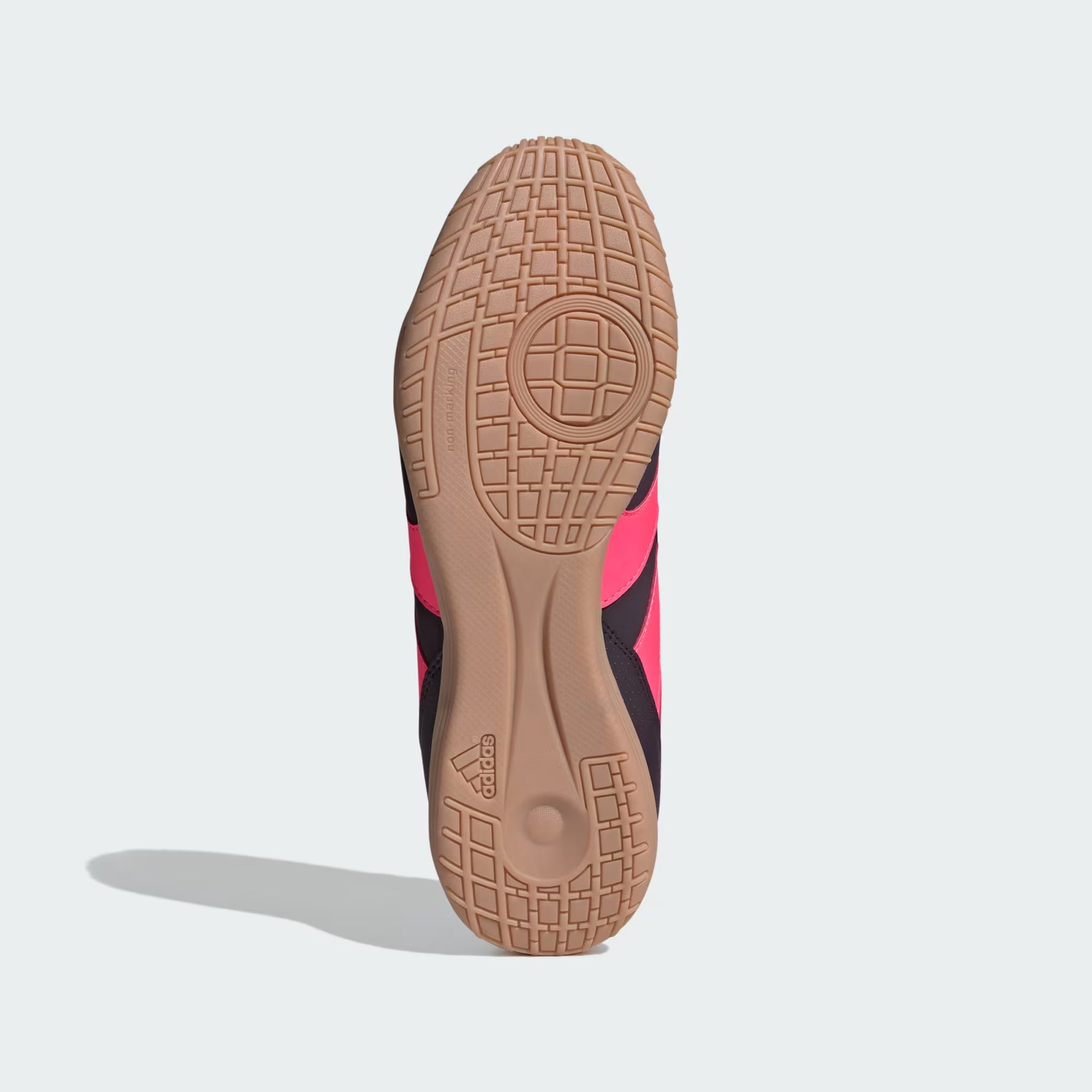 Close-up of a shoe sole with a textured pattern on a light gray background