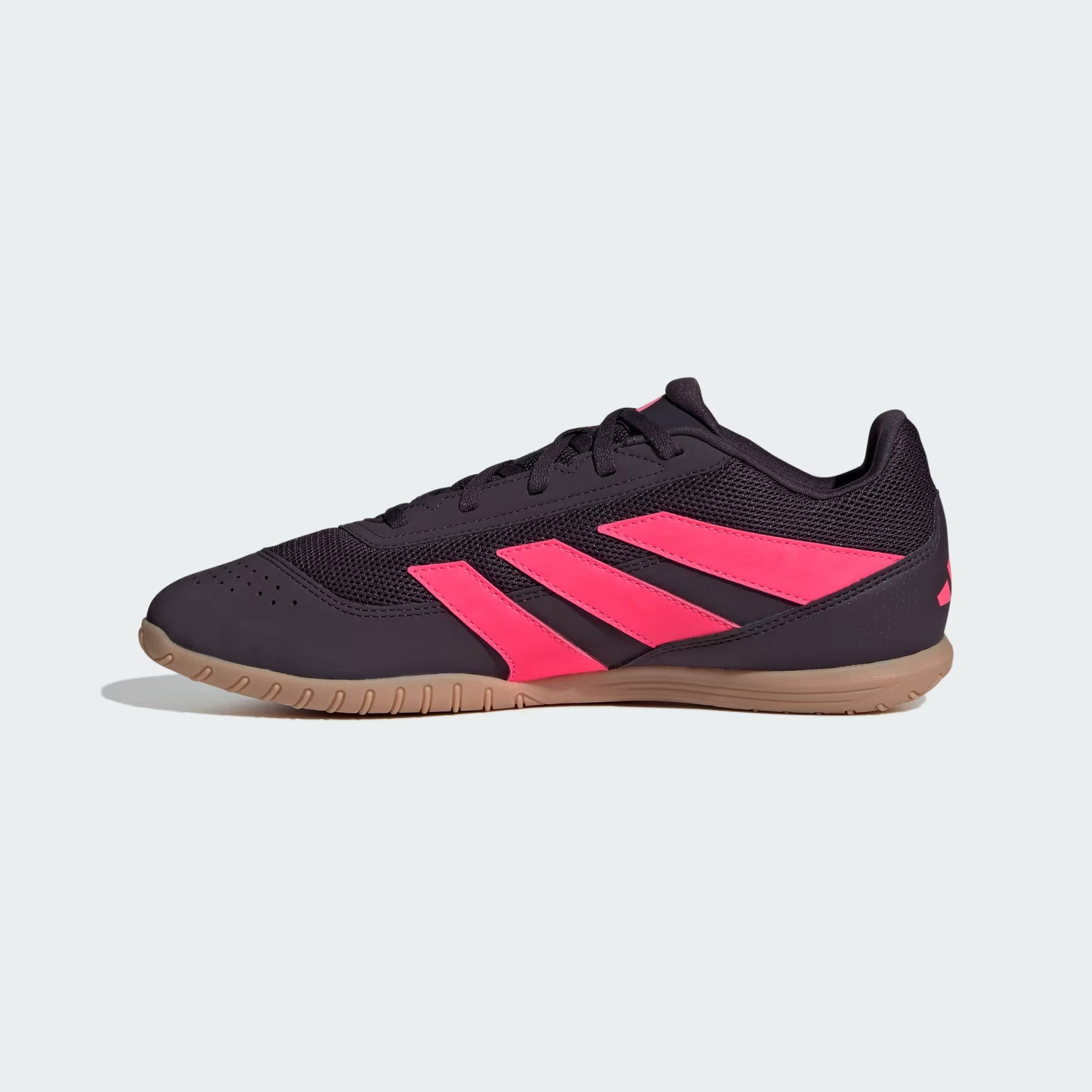 Black and pink sneaker with Adidas logo on a light gray background