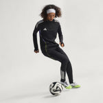 Person wearing an Adidas tracksuit with a soccer ball on a white background