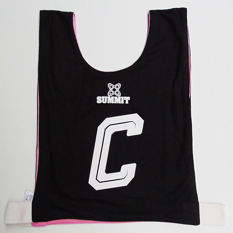 Reversable netball bib in black and pink. C - Centre print for Netball Club.