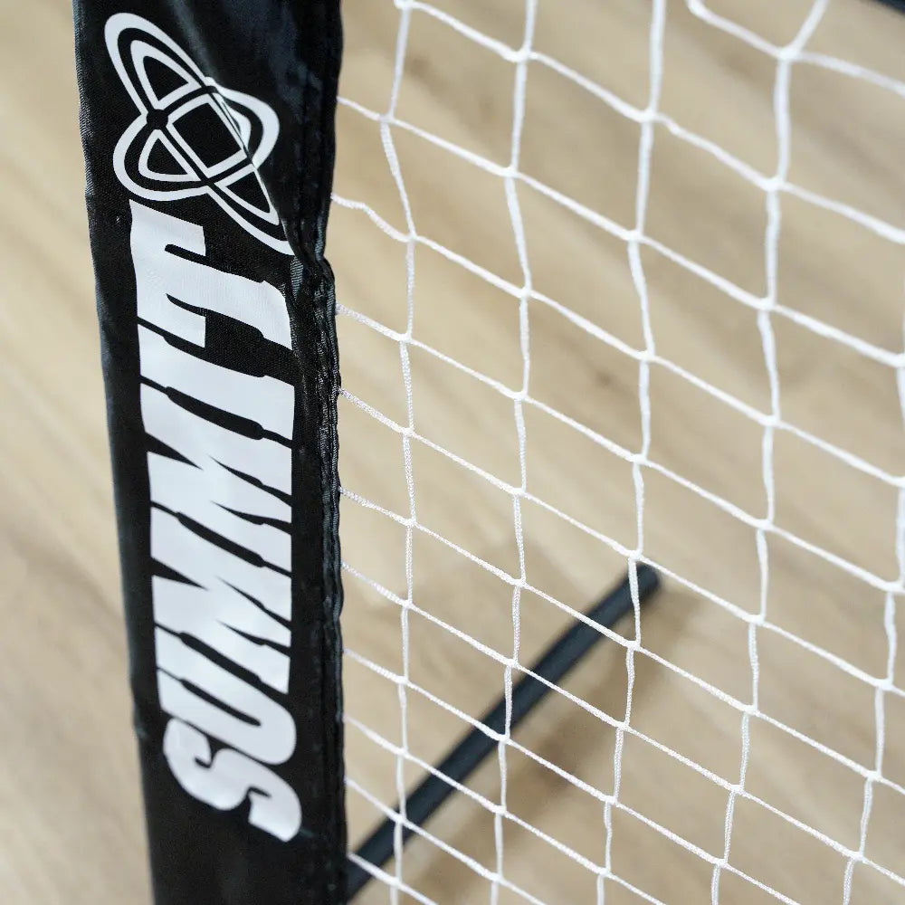 close up of summit logo on nylon sleeve of portable tennis net 