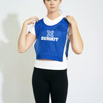 Woman wearing summit elastic waist sports bib in blue