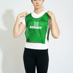 Woman wearing summit elastic waist sports bib in green
