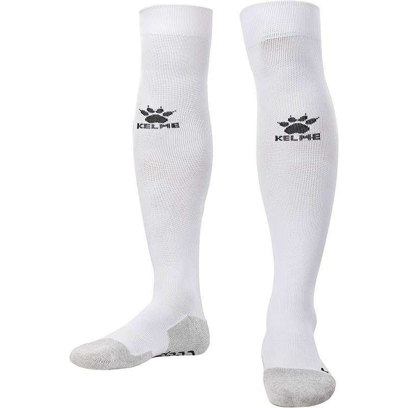Kelme Football Grip Socks in white. Long Football knee high grip socks for professional soccer players.