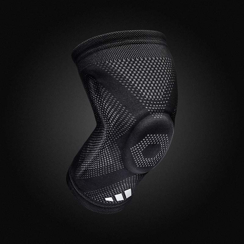 Provide support for all sport, training, and exercise with the adidas Aeroready Knee Support - pictured on a black background
