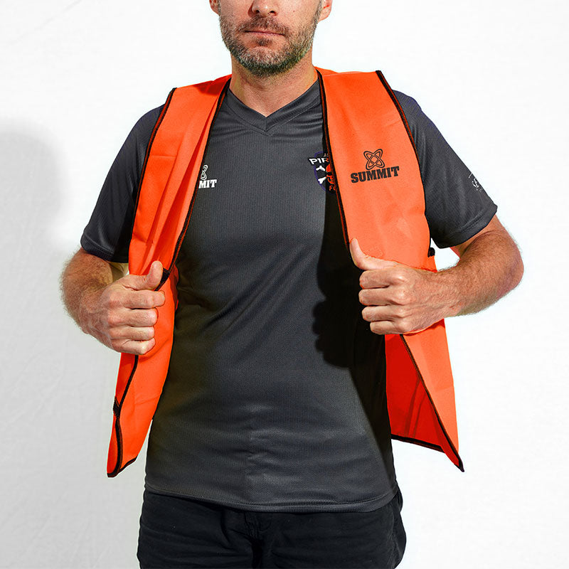 Safety bib for working, sports and high vis. Fluro orange open front mesh bib. Man closing mesh bib for safety.