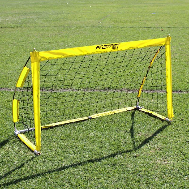 FASTNET 0.9 x 1.5m (3'x5') Soccer Net in yellow on grass football pitch. Soccer Net for kids and recreational games of soccer.